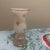This piece is a vintage opaline glass hurricane vase, likely from the mid-20th century. It features a classic frosted...