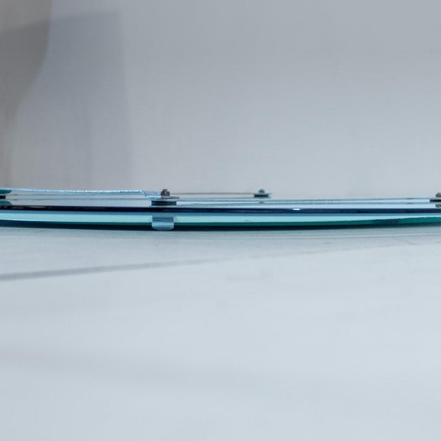 Mid- century Modern Italian Oval Beveled Glass Mirror, Antonio Lupi for Cristal Luxor 1970s Layered refinement: a 1970s...