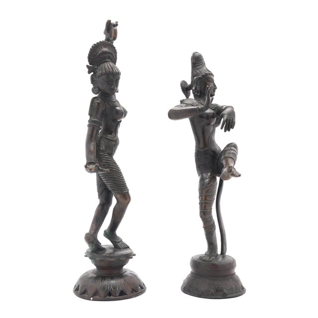A pair of 19th-century Tamil Nadu bronze figures of Shiva and Parvati, cast in panchaloha using the traditional lost-wax...