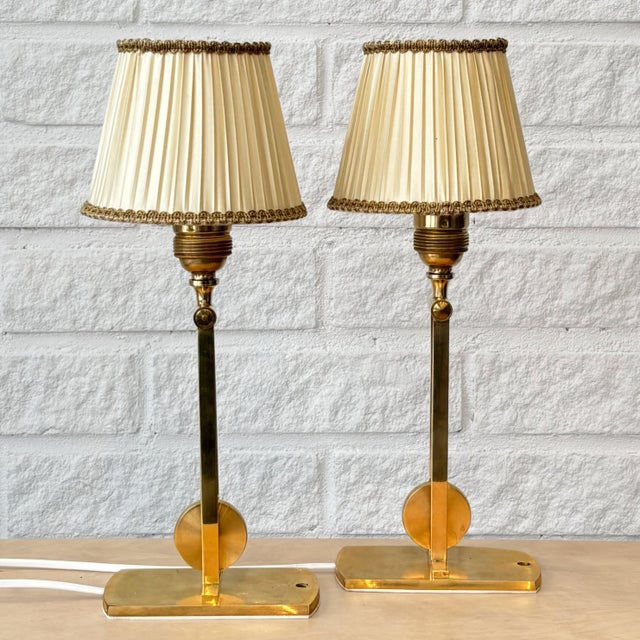 A pair of elegant table or wall lamps, model 340, designed by Kaare Klint and produced by the Danish manufacturer Le Klint...