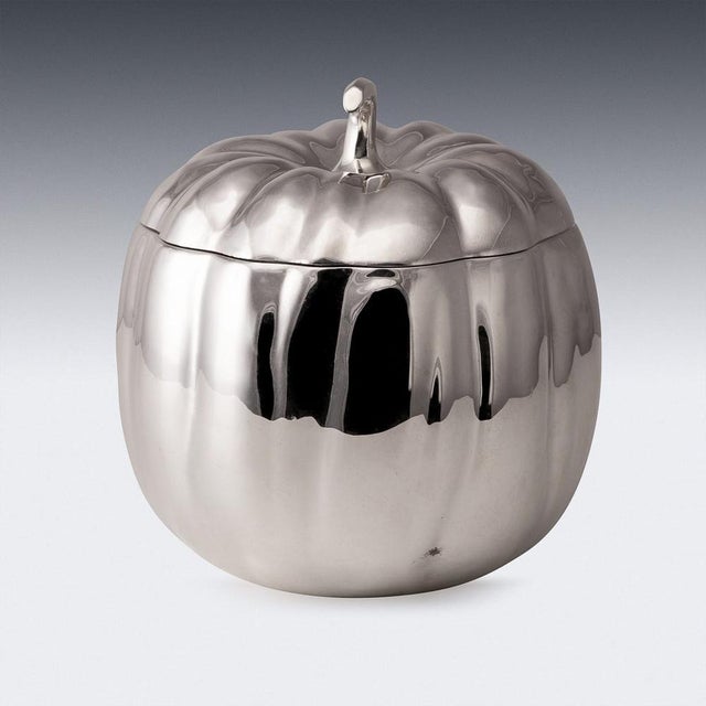 A vintage 20th century italian silver plated ice bucket in the form of a pumpkin. Upon lifting the lid a glass liner is...