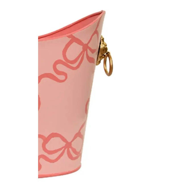 New special order item. Handpainted on a playful pink background, the peach bows and gold tone lion head handles is a...