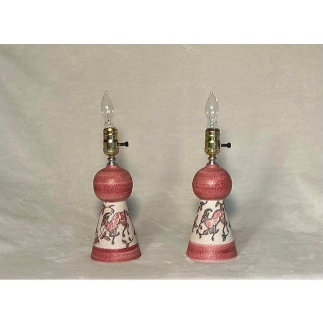 Hand painted 1950s-1960s mid-century modern era, fabulous pair of Italian art pottery small table lamps with new white...