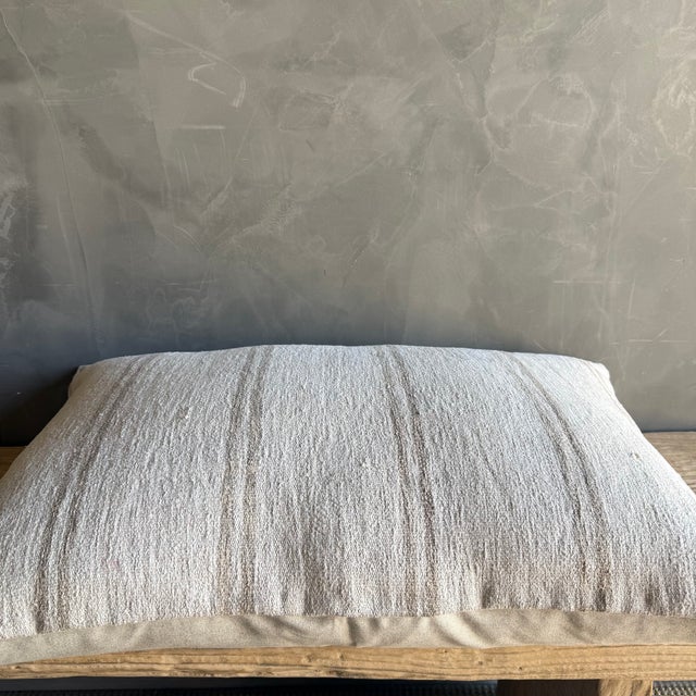 Creamy white hemp rug pillow. Soft hand, linen blend backing with zipper closure. Spot cleaning is recommended, or dry...