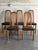 This set of 5 dining chairs features tall arched backrests with vertical spindles. Vintage Mid-Century Modern 1980s....