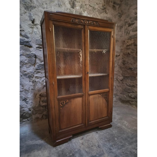 This French display cabinet dates from the period between 1930 and 1950. It is made of beech and fitted with two glazed...