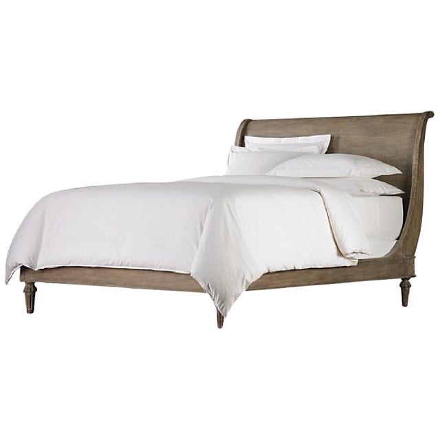 Elevate your bedroom with this elegant sleigh bed, featuring timeless craftsmanship and a beautifully weathered wood...