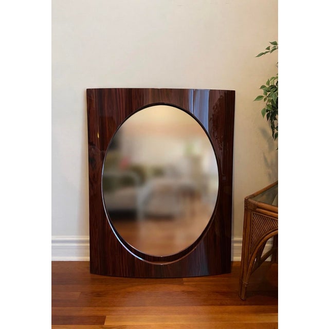 A late 1970s- early 1980s recessed wall mirror defined by its deep inset, convex-profile frame and shadowbox-style...