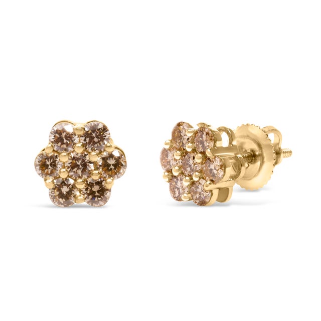 Immerse yourself in the elegance of these floral stud earrings, meticulously crafted from radiant 14K yellow gold. Each...