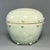 This lidded jar is crafted from authentic Longquan Celadon. It features soft celadon‑green glaze, relief‑carved floral...