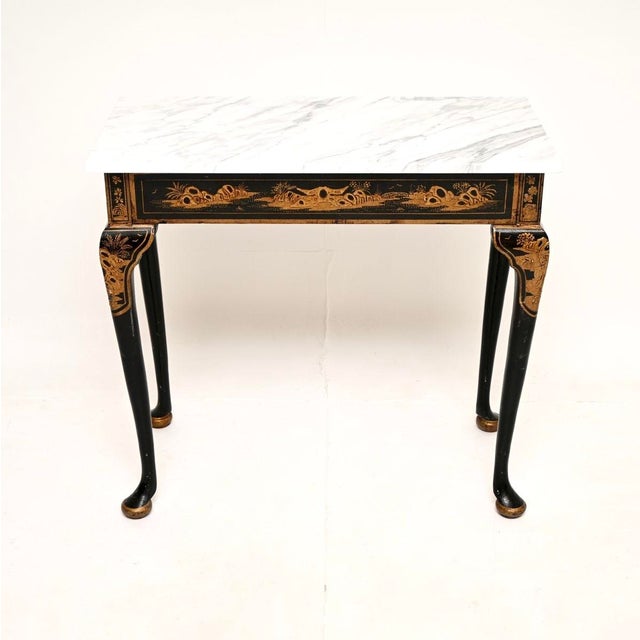 A gorgeous and very rare antique Victorian lacquered chinoiserie marble top side table. This was made in England, it dates...