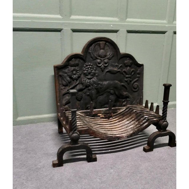 Very Heavy Large Fire Back with Andirons and Large Grate The fire has a friendly looking lion with a Rose, a thistle , a...