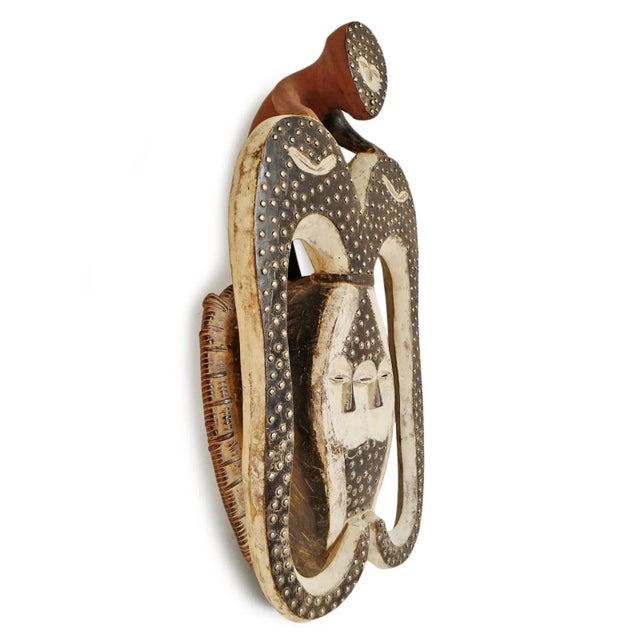 Large rare vintage carved wood Lega twin mask. Original aged black and white painted finish and hammered nail heads....