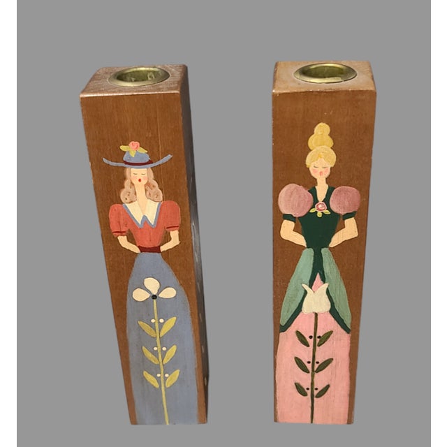 Add a touch of vintage charm to your home decor with this delightful pair of hand-painted wooden candle holders. The...