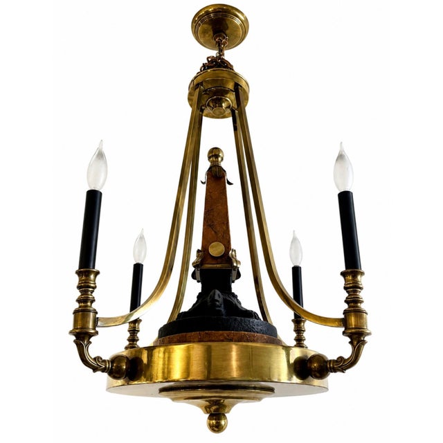 This is a Neoclassical style 4 candelabra lights brass chandelier from 90's. It features a faux-porphyry or marbleized...