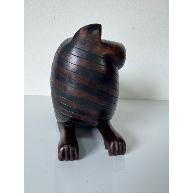 A charming and sculptural 1980’s hand-carved mahogany cat that doubles as a cleverly concealed storage box. This...