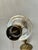 Vintage solid brass oil lamp with glass chimney. This authentic lamp has a lacquered antique brass finish.