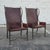 This is a beautiful pair of sculptural metal and leather wingback armchairs by Global Views. They feature a tall, elegant...
