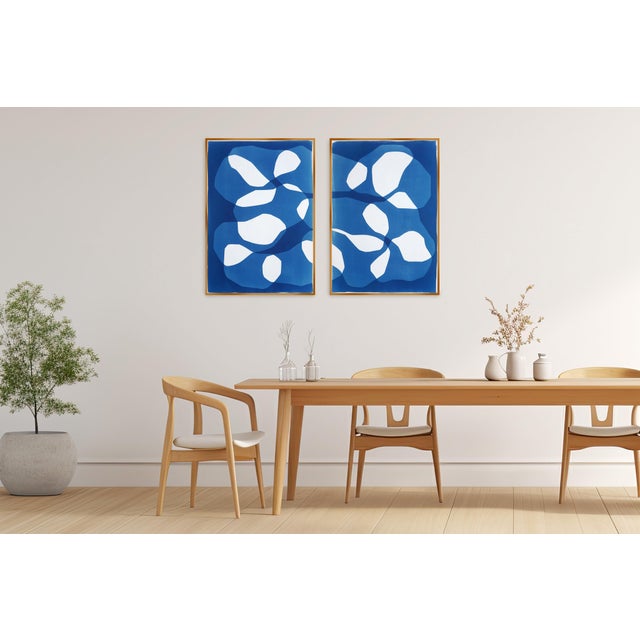 Asteroid Belt is an exclusive handmade cyanotype diptych that features modern, abstract rocky shapes rendered in deep...