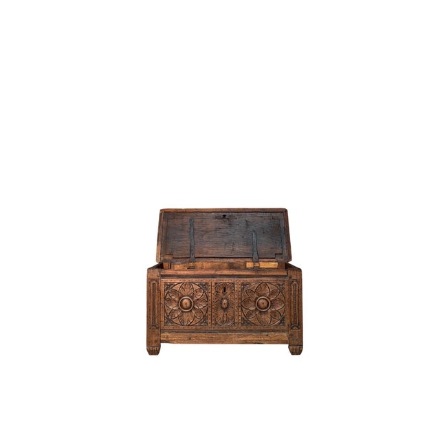 An impressive 18th-century walnut chest, decorated on three sides with elegant, finely carved rosettes. The rich...