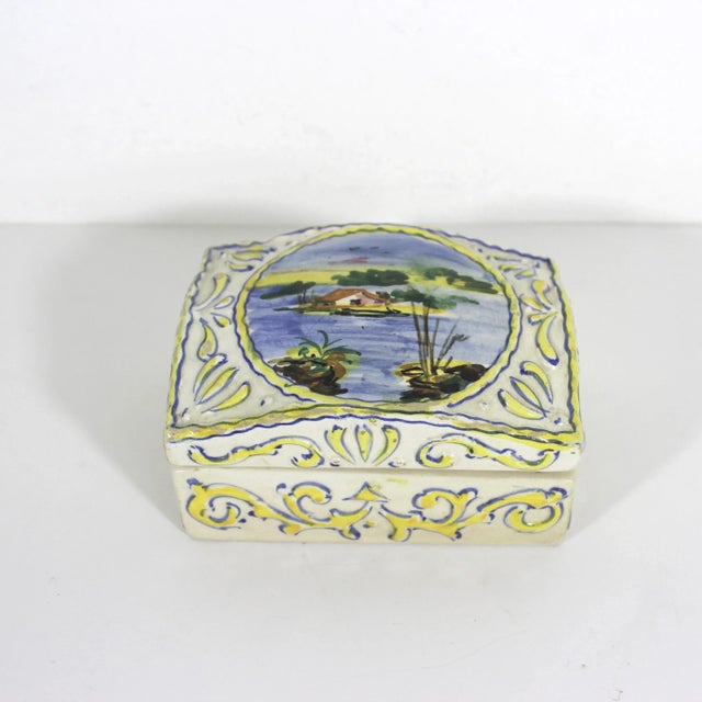 Very old ceramic lidded box with raised detail. Hand painted and made in Italy. This has small chips all around the edges,...