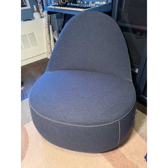 A pair of "Mitt" Lounge Chairs designed by Harry and Claudia Washington and manufactured by Bernhardt Design. The organic...
