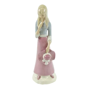 Mid 20th Century European Porcelain Figurine of a Girl