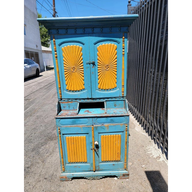 1970's vintage farmhouse style solid wood kitchen cabinet. Four wooden doors, Three shelves and four drawers. Shelves are...
