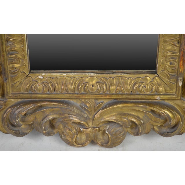 A very fine carved giltwood antique mirror. Mirror is most likely a late 18th C. (possibly early 19th C.) Florentine...
