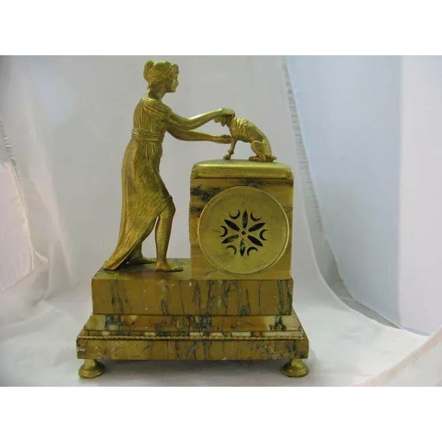 19th century three-piece set, very finely gilt chased French Empire by Japy Freres -gilt bronze and marble clock includes...