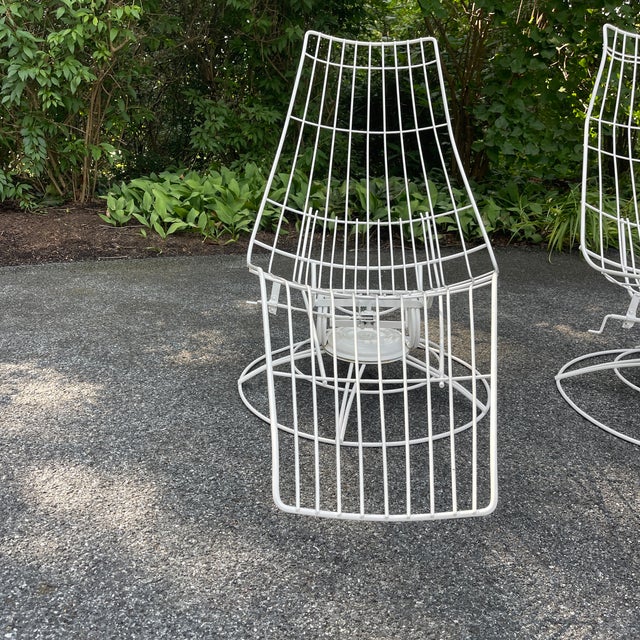 A pair of vintage “Siesta” Chaise Lounges attributed to Homecrest. The metal chairs are a brilliant design and extremely...