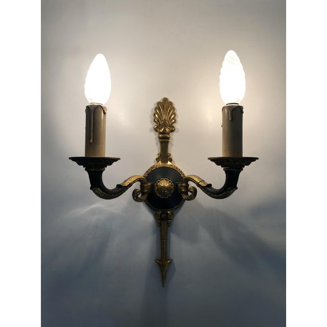 Pair of Empire Style Double-Light Bronze Arrow Wall Sconces Charming vintage pair of arrow wall sconces dating from the...