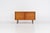 Minimalist cabinet by Gunter Renkel for Rego (Germany, 1960s). Crafted in warm teak, the cabinet features clean...