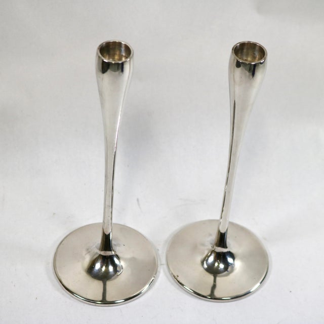 An exceptional pair of original mid-century modern "Tulip" or "Trumpet" style taper candle holders designed by the...