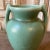 Here is a beautiful vintage Art Deco petite two handled pottery vase in matte green glaze. This vase is in superb...