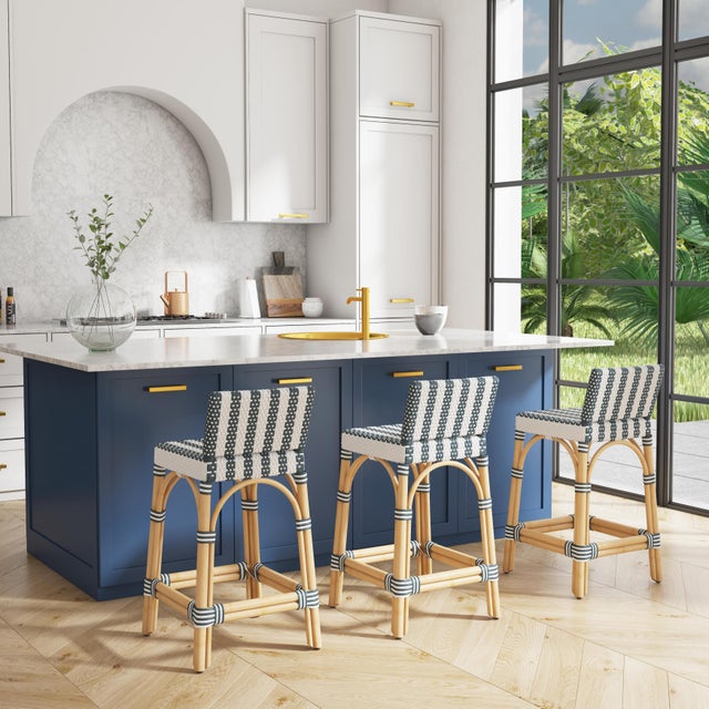 Combining clean lines with tropical materials, this Butler Specialty Company stylish low back counter stool infuses modern...