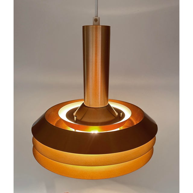 Mid century Danish style pendant lamp, in the style of Carl Thore, with a copper bronze finish and white enamel Dimensions...