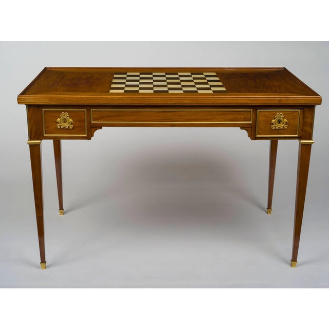 Gorgeous vintage table in beautiful condition. Of rectangular form, the removable top with an inlaid chessboard reversing...