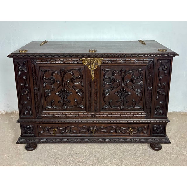 Magnificent Spanish blanket chest crafted in richly carved wood with bold Renaissance Revival styling. The chest features...
