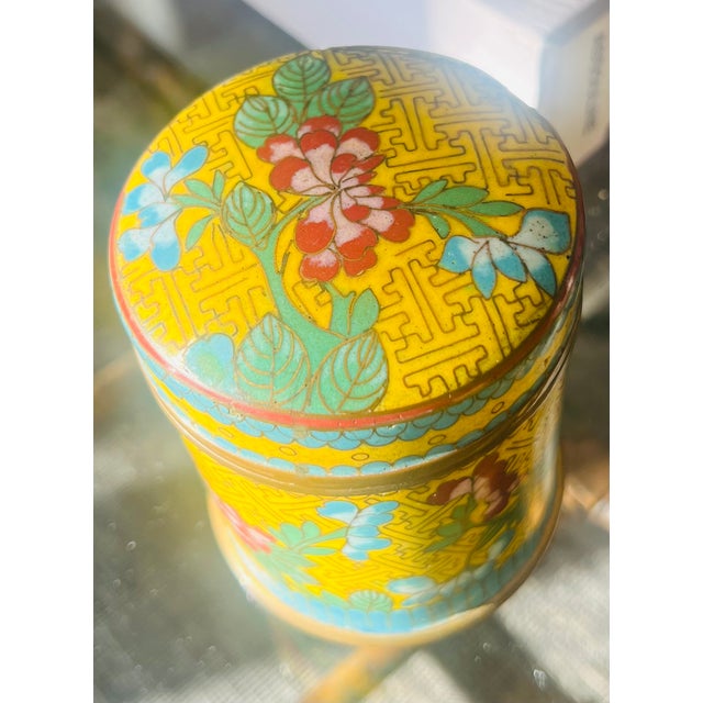 A jewel-like Chinese cloisonné covered jar featuring stunning sunny yellow enamel accented with brilliant turquoise blue,...