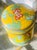 A jewel-like Chinese cloisonné covered jar featuring stunning sunny yellow enamel accented with brilliant turquoise blue,...