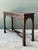 Exemplifying fine Chinese Chippendale and Gothic Revival craftsmanship, this mid-century console table features elaborate...