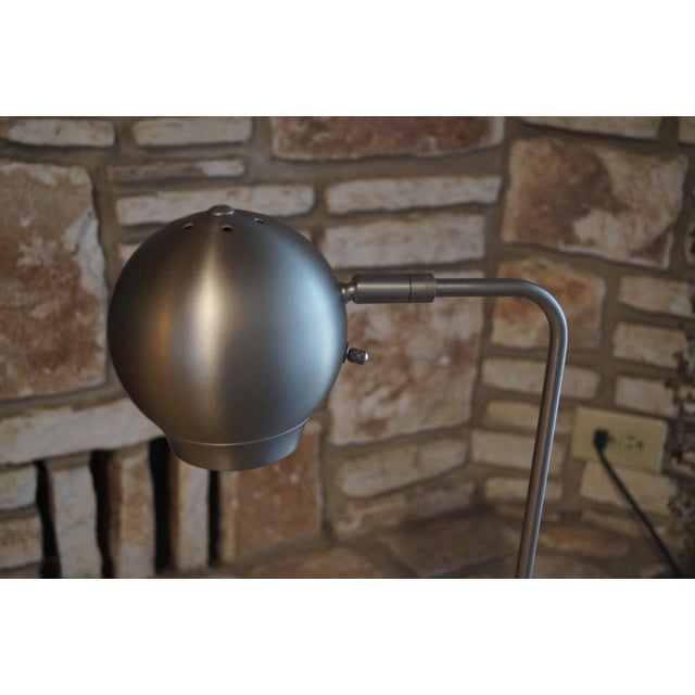 A Robert Sonneman floor lamp in brushed steel, which was designed for Kovacs. This piece is in good vintage condition with...