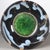 A striking Chinese ceramic tea bowl. The exterior features a deep, dark brown "tortoiseshell" glaze with a prominent, all-...