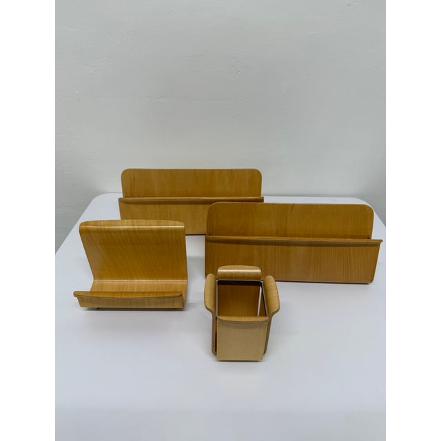 Four piece Michael Graves designed desk set with two mail holders (incoming and outgoing), pen holder and organizer. Both...