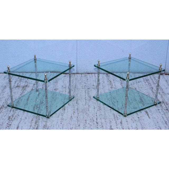 1970s Mid-Century Modern polished nickel with brass hardware faux bamboo two tier end tables by Baker, with vintage...
