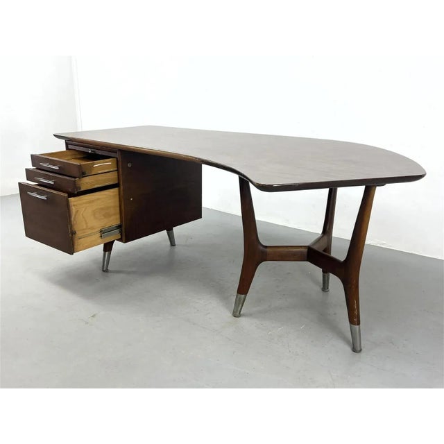 Very rare mid century Modern walnut veneer/laminate top boomerang-angled executive desk by Alma Desk Co. from the...