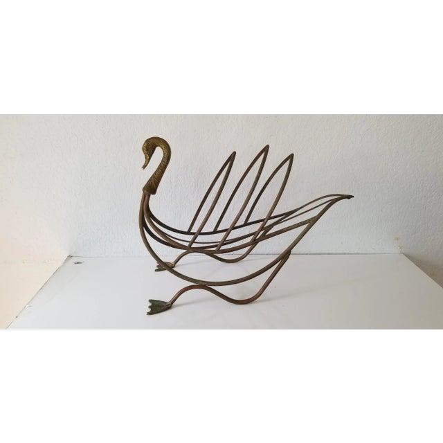 Vintage Maison Jansen style brass swan magazine rack or book holder, stamped Made in Italy. C. 1950's. Brass retains...