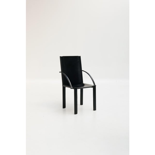 Armchairs designed by Carlo Bartoli for Matteo Grassi, likely the Carol model, feature a clean silhouette and are entirely...