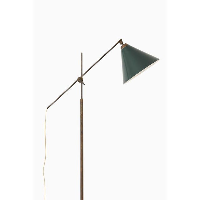 This rare adjustable floor lamp, designed by thomas valentiner and produced by poul dinesen in denmark, is a compelling...